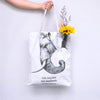 "ride bicycles not elephants" tote bag